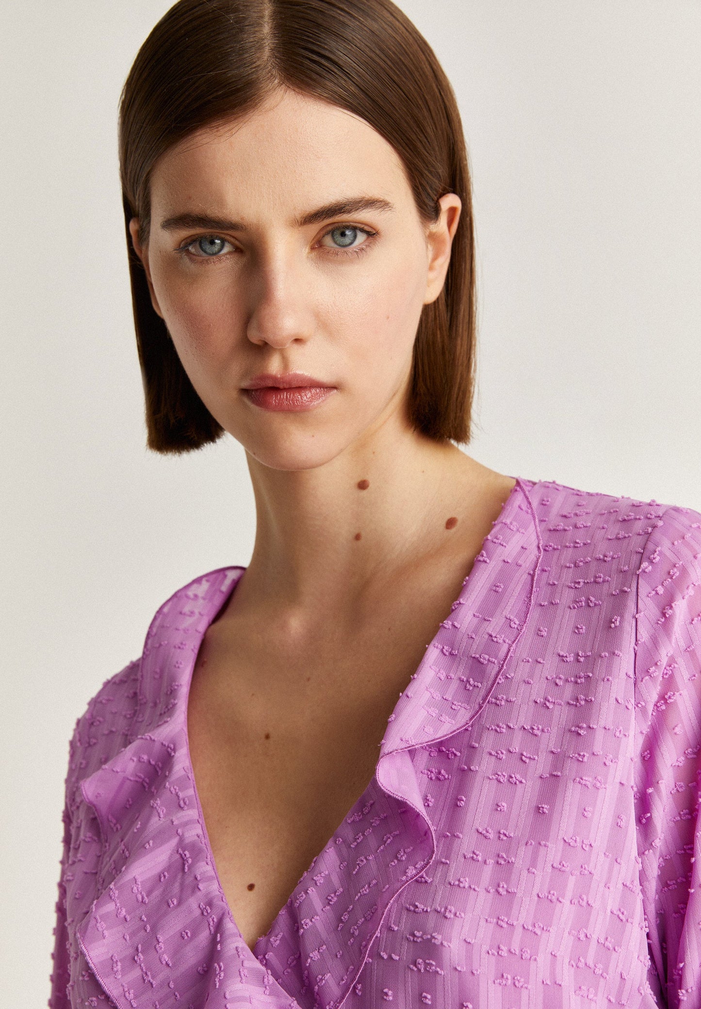 BLUSA PLUMETI BAJO ASIMÉTRICO
